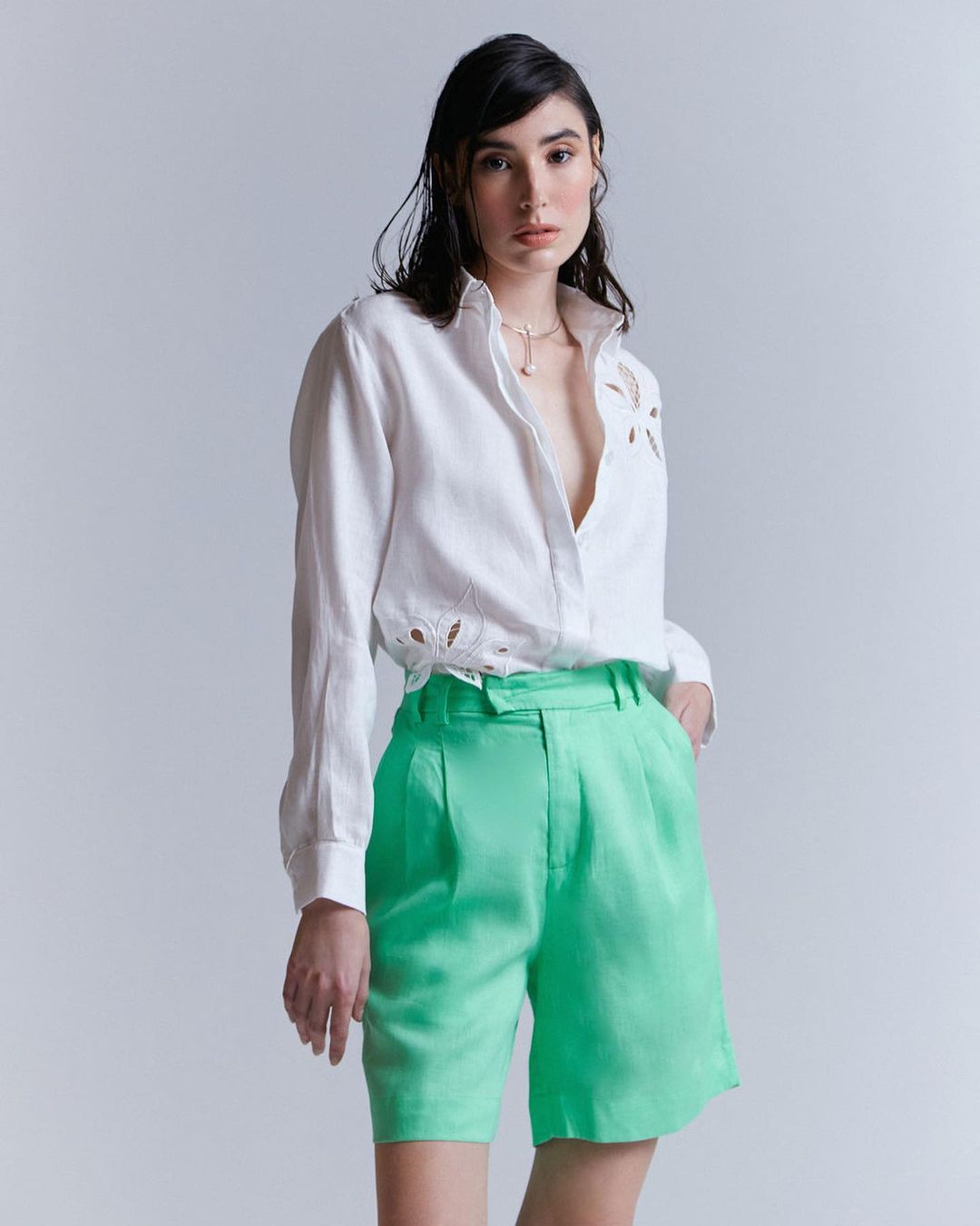 a lady in white shirt with light green pants